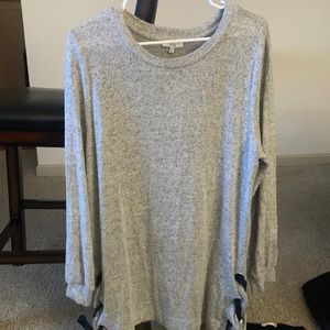 Grey super soft sweater with black ties on side